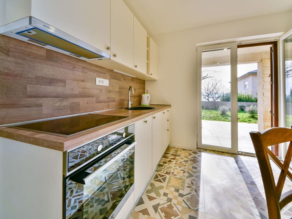 Cabinetry, Furniture, Countertop, Window, Wood, Building, Interior Design, Flooring, Floor, Kitchen