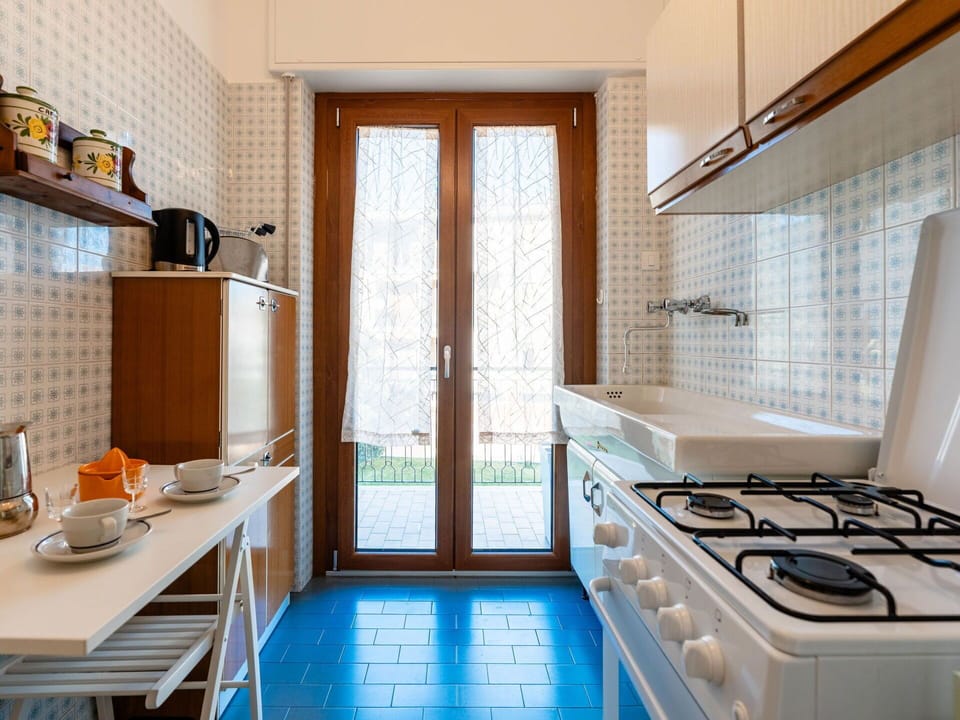 Kitchen, Flooring, Interior Design, Wood, Floor, Countertop, Major Appliance, Kitchen Appliance, Lighting, Room