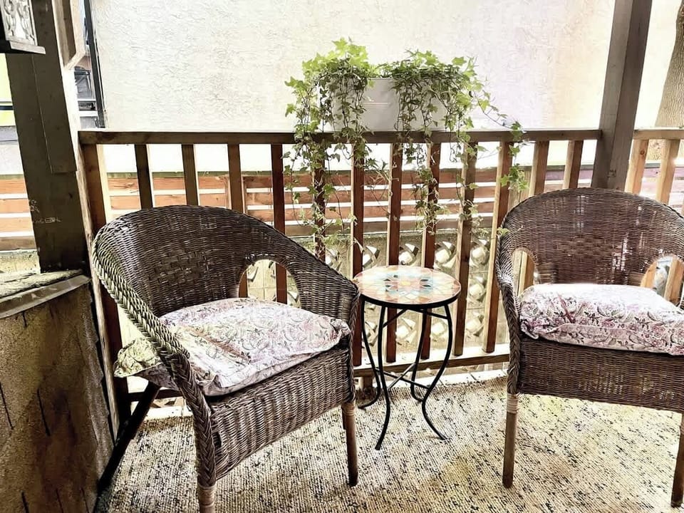Covered Patio which leads to fully fenced backyard with outdoor furniture.