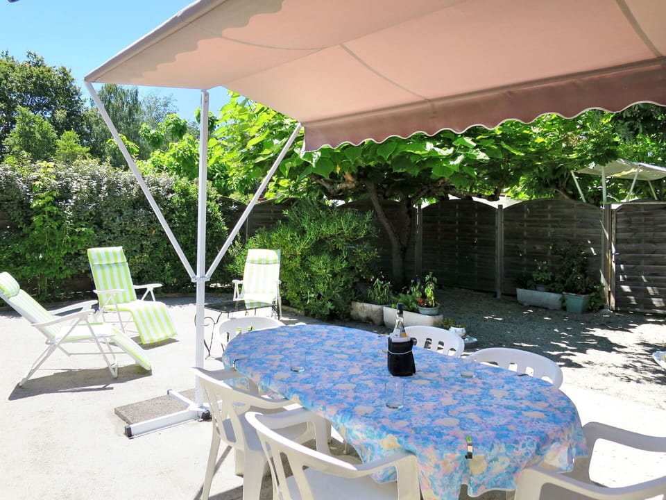 Plant, Furniture, Property, Table, Chair, Azure, Outdoor Furniture, Outdoor Table, Shade, Building