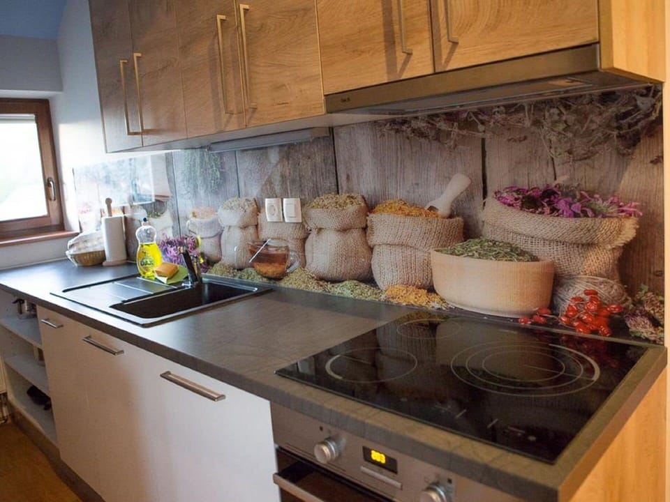 Property, Countertop, Cabinetry, Wood, Kitchen, Kitchen Stove, Interior Design, Kitchen Appliance, Floor, Flooring