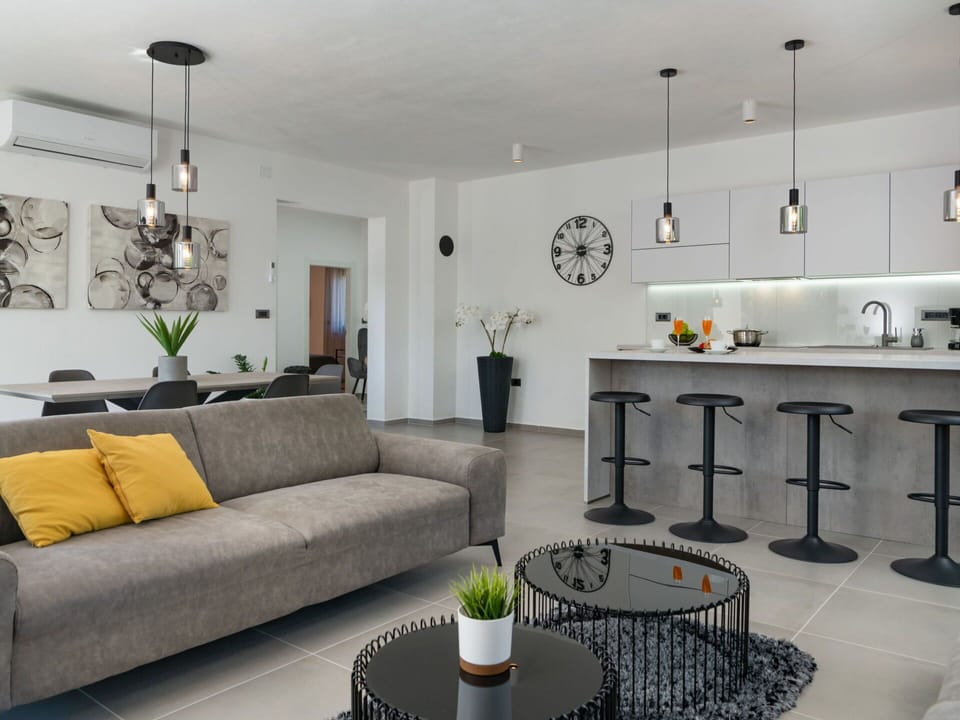 Furniture, Couch, Property, Plant, Table, Green, Picture Frame, Interior Design, Lighting, Living Room