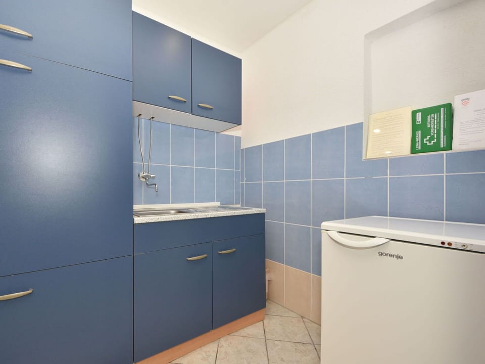 Cabinetry, Furniture, Building, House, Purple, Flooring, Floor, Wall, Material Property