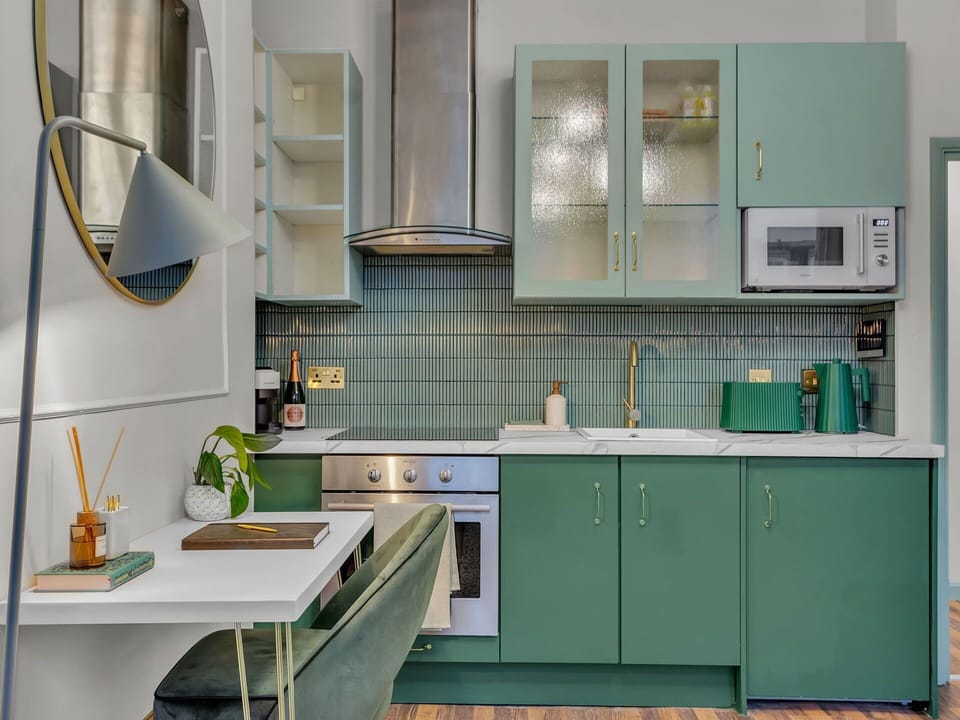Interior Design, Kitchen Appliance, Kitchen, Flooring, Furniture, Major Appliance, Countertop, Cabinetry, Light Fixture, Floor