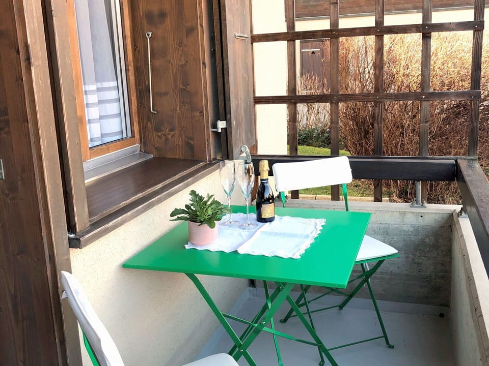 Table, Building, Wood, Plant, Interior Design, Shade, Window, Outdoor Furniture, Flooring, Floor