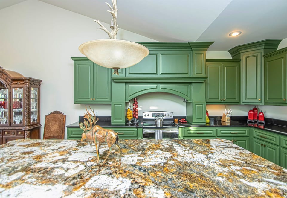 Green and Gold Accents Throughout the Kitchen for a Modern Yet Rustic Feel