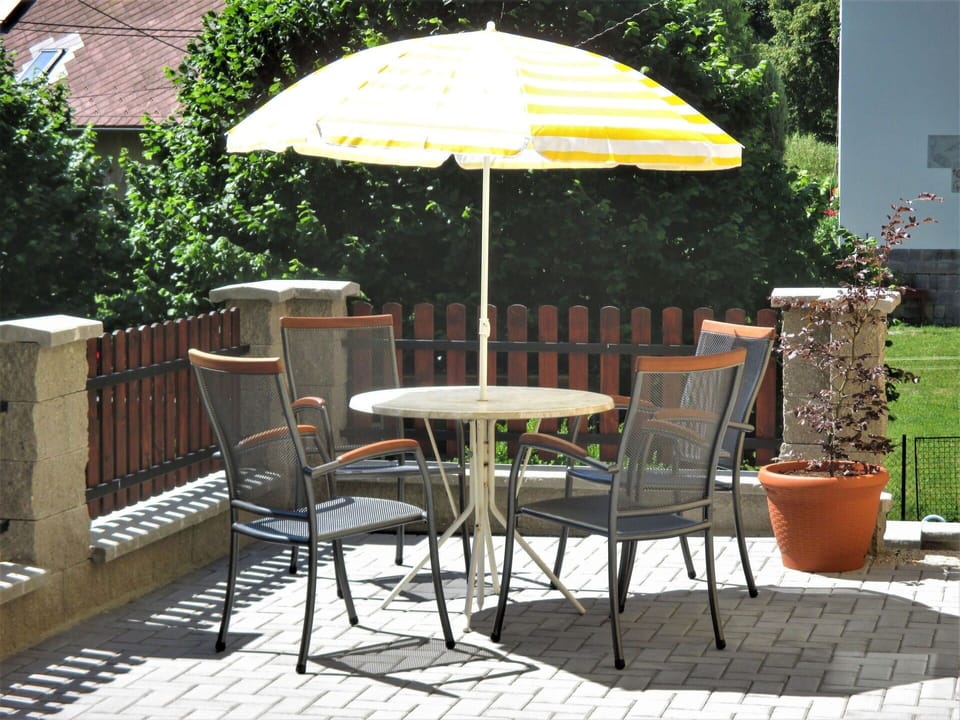 Plant, Property, Furniture, Chair, Table, Umbrella, Outdoor Table, Outdoor Furniture, Shade, Flowerpot