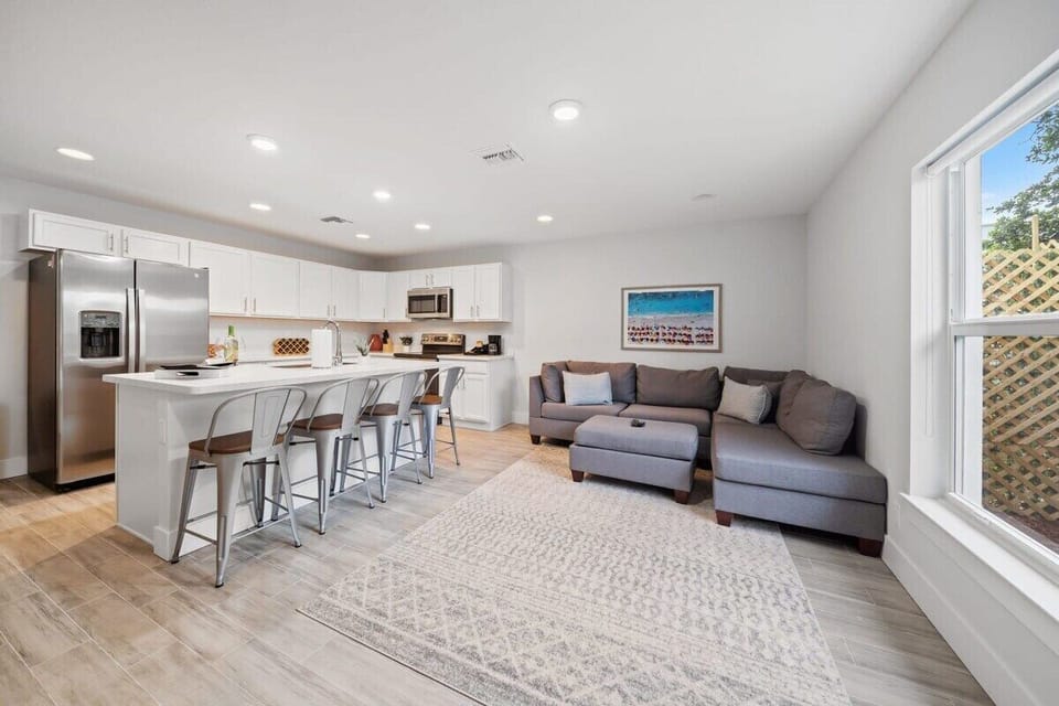 Living room with comfortable couch & ottoman