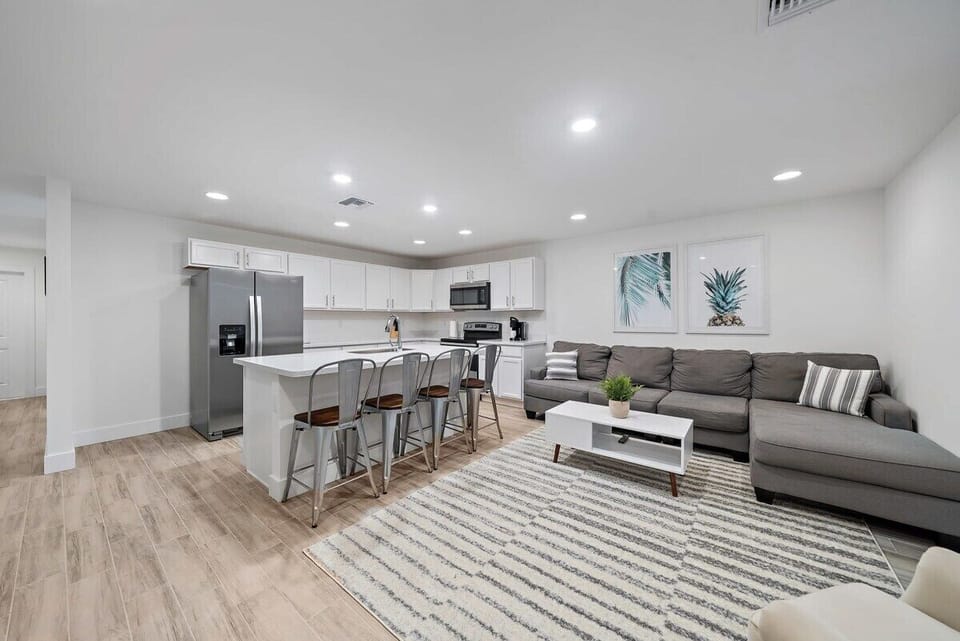 Living room with comfortable couch & ottoman