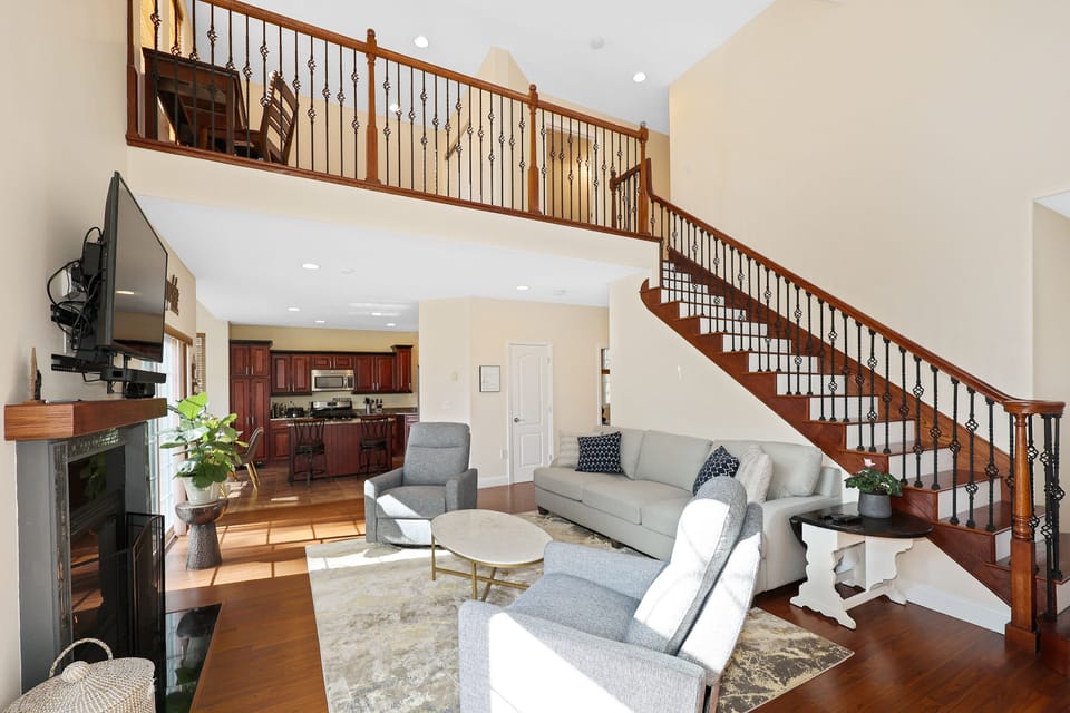 Living room and stair to 2nd floor bedroom, bathroom and loft