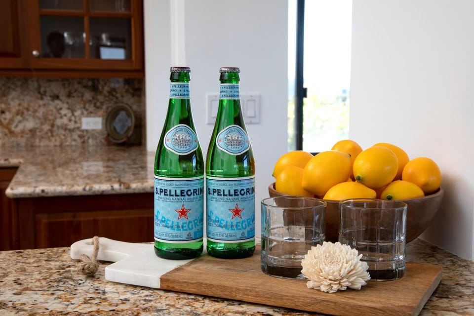 A touch of Italian luxury awaits—enjoy complimentary San Pellegrino and sun-kissed lemons during your stay