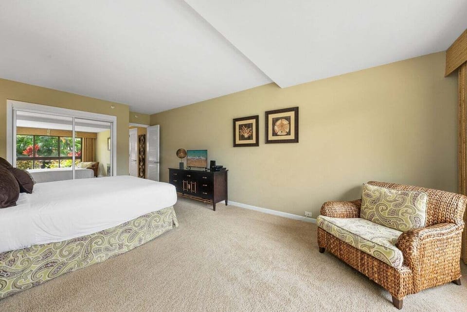 Unwind in a spacious bedroom with mirrored closets and lush outdoor scenery