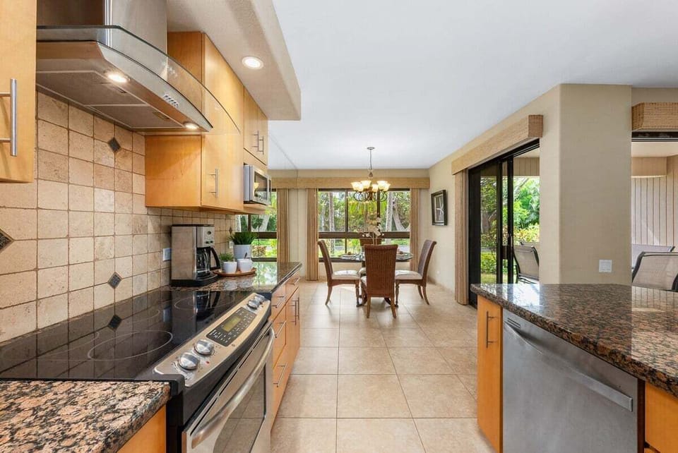 Perfect for preparing fresh meals while enjoying garden views from the dining area