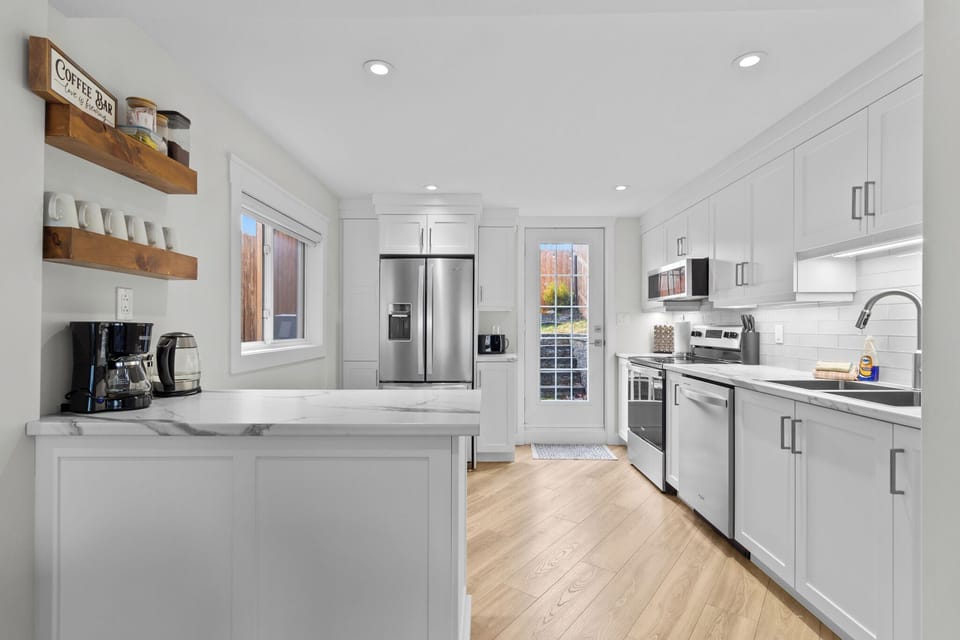 Whip up your favorites in this sleek, fully equipped kitchen! Stainless steel appliances, marble countertops, and a cozy coffee corner make cooking a delight.