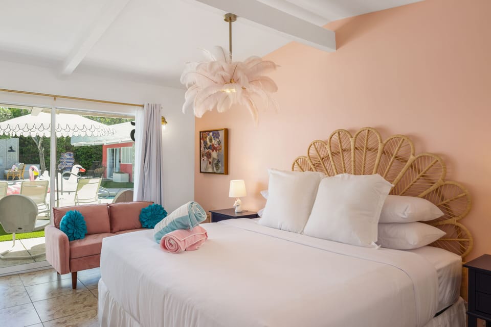 Palm Springs Perfection! Sink into this sunny sanctuary featuring playful decor, a plush king bed, and easy access to the patio.