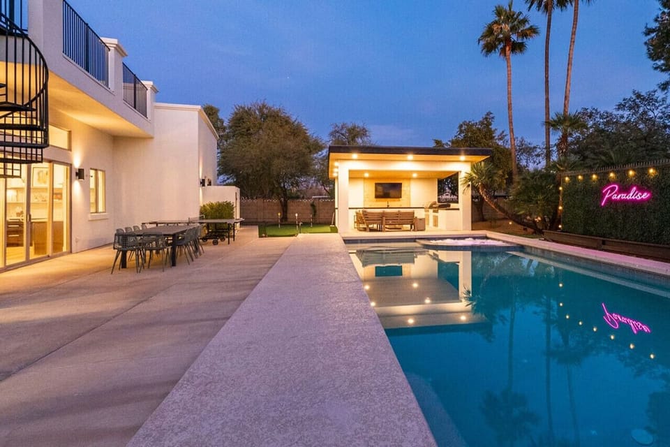 Enjoy the view by the pool side with the warm lights at night.