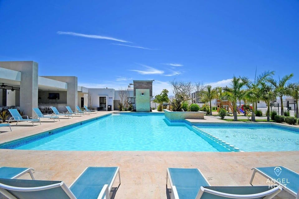 In the Hispania community, you’ll find an awesome pool surrounded by lounge chairs.