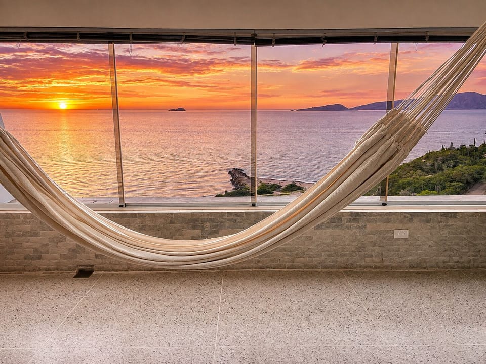 Feel the CARIBBEAN BREEZE in the HAMMOCK as OCEAN VIEWS glow at sunset