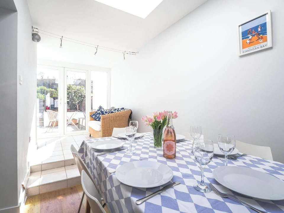 Dining area leading to French doors and the patio area