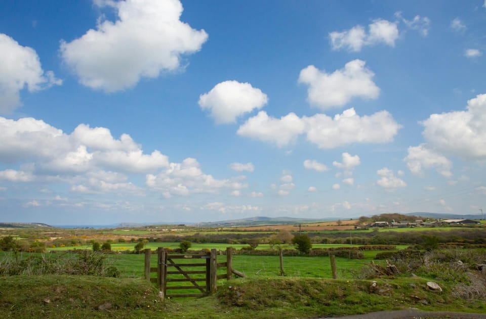Far reaching countryside views across fields from Cnwc y Bran