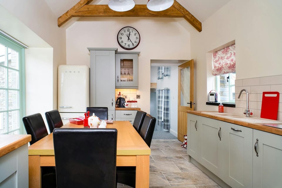 Kitchen and dining room with table and six chairs
