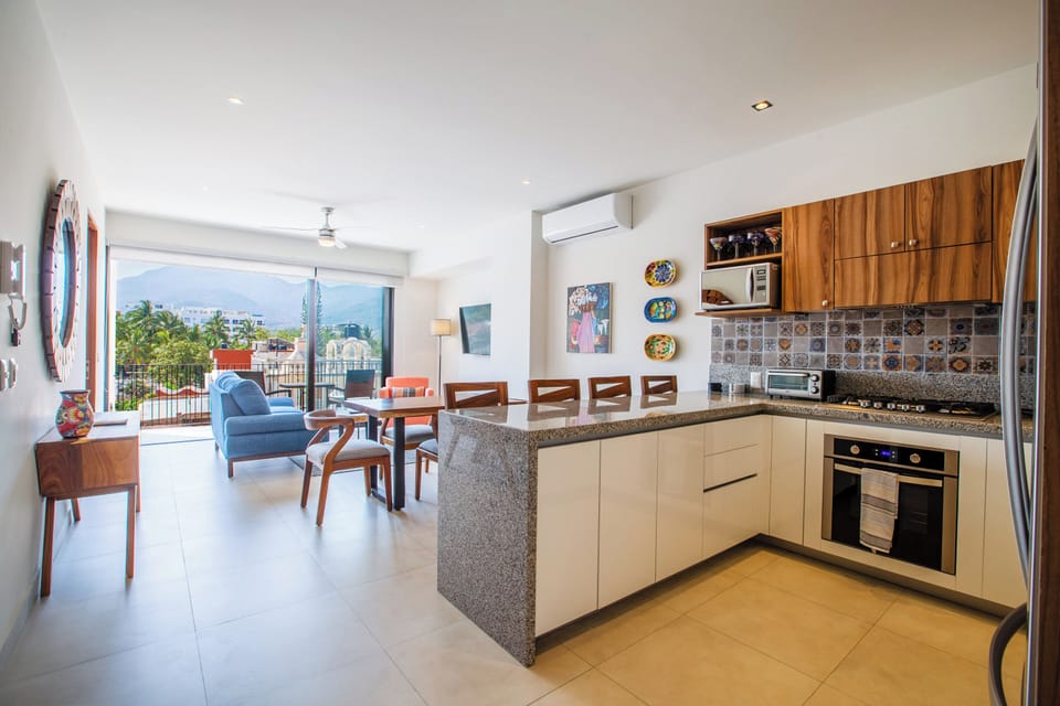 Kitchen amenities include a stove, oven, full-size fridge and microwave