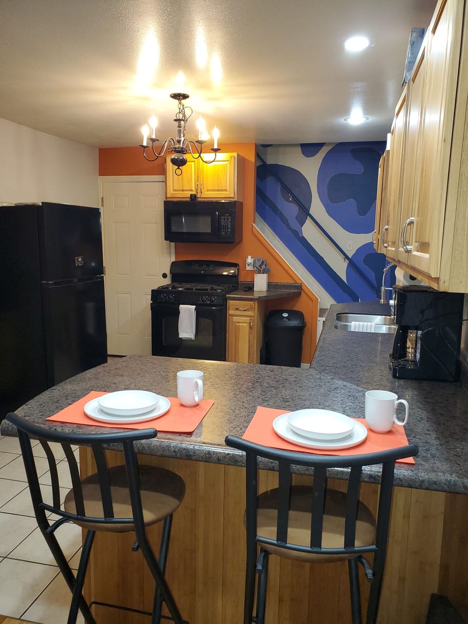 View of kitchen with garage and patio area access.