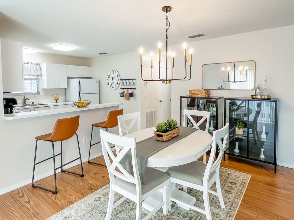 Open Dining area with a 4 top Dining Table along with a 2 seat Breakfast Bar.