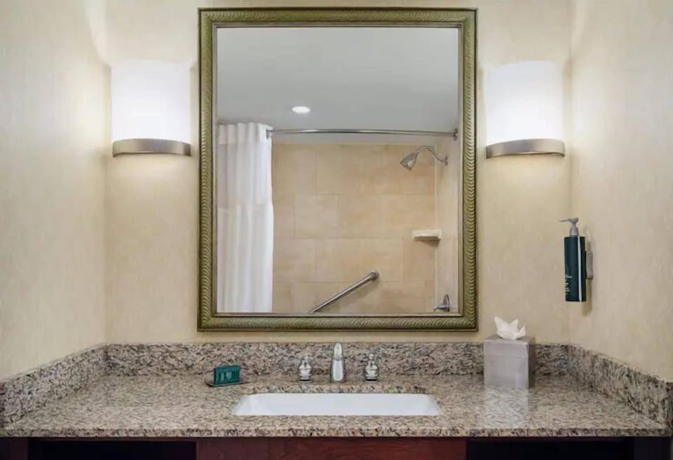 Refresh under a soothing shower with a wide vanity.