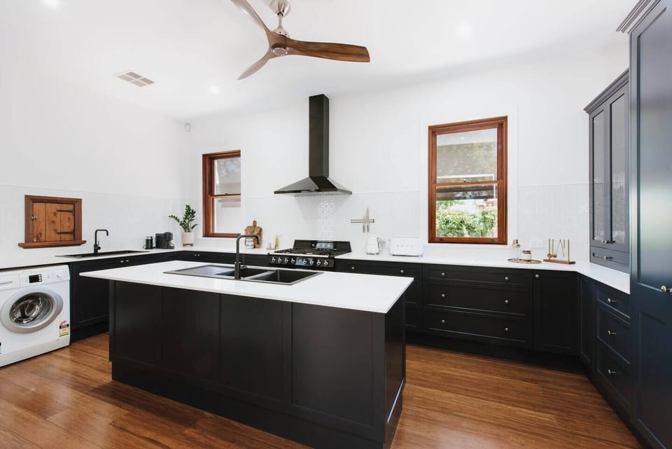The modern, chef-style kitchen is fully equipped with everything you need to cook up a feast, plus laundry facilities including a washing machine and a dryer. 