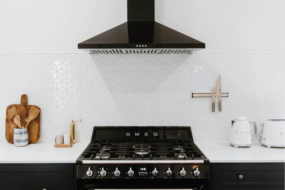 A deluxe SMEG oven and stove welcome you to get creative in the kitchen.