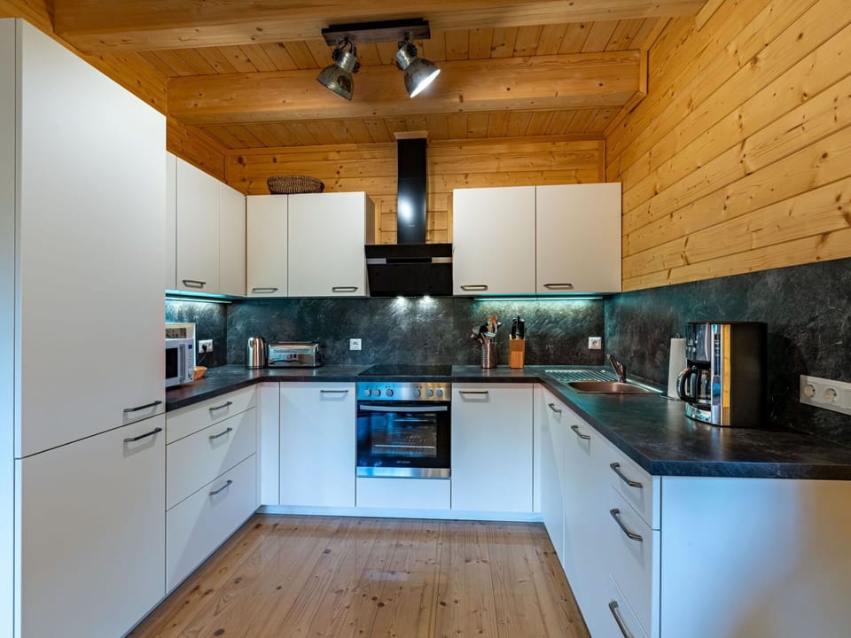 Countertop, Cabinetry, Property, Kitchen Appliance, Kitchen Stove, Sink, Kitchen, Lighting, Home Appliance, Wood