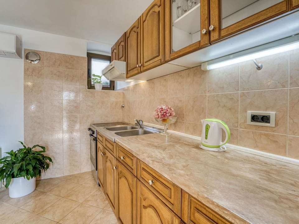 Cabinetry, Countertop, Property, Tap, Sink, Kitchen Sink, Building, Wood, Interior Design, Kitchen