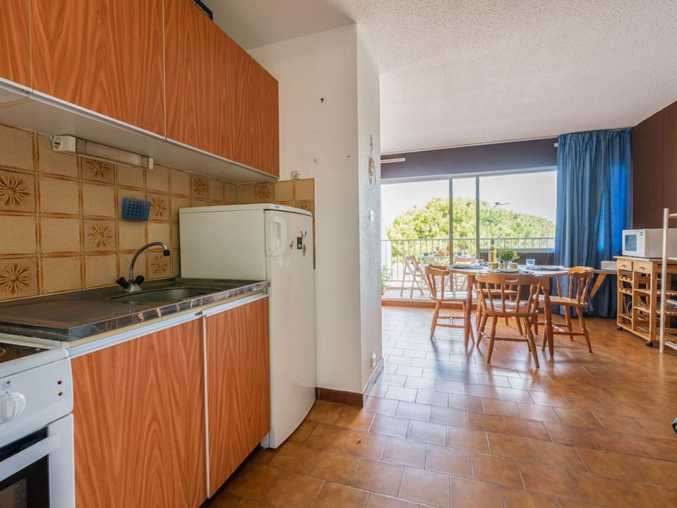 Furniture, Cabinetry, Countertop, Table, Kitchen Stove, Wood, Kitchen Appliance, Interior Design, Kitchen, Building