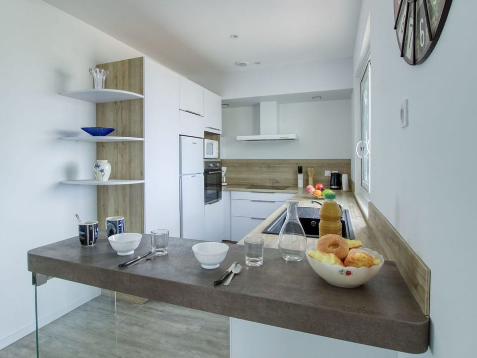 Furniture, Property, Cabinetry, Food, Countertop, Building, Table, Tableware, Interior Design, Kitchen
