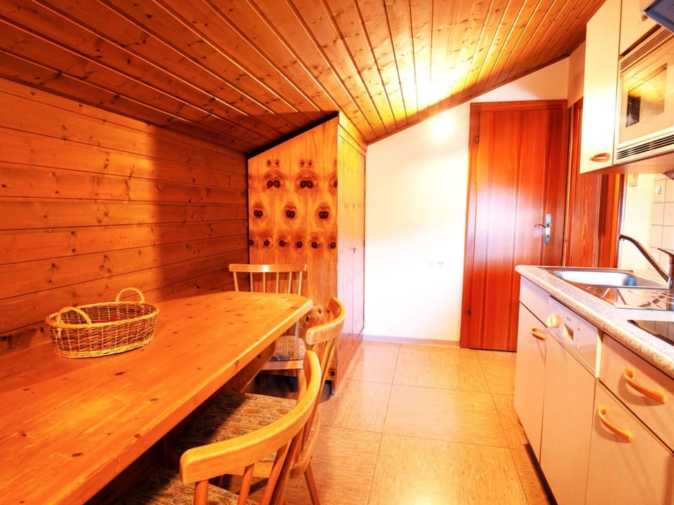 Furniture, Cabinetry, Table, Property, Building, Wood, Countertop, Interior Design, Orange, Drawer