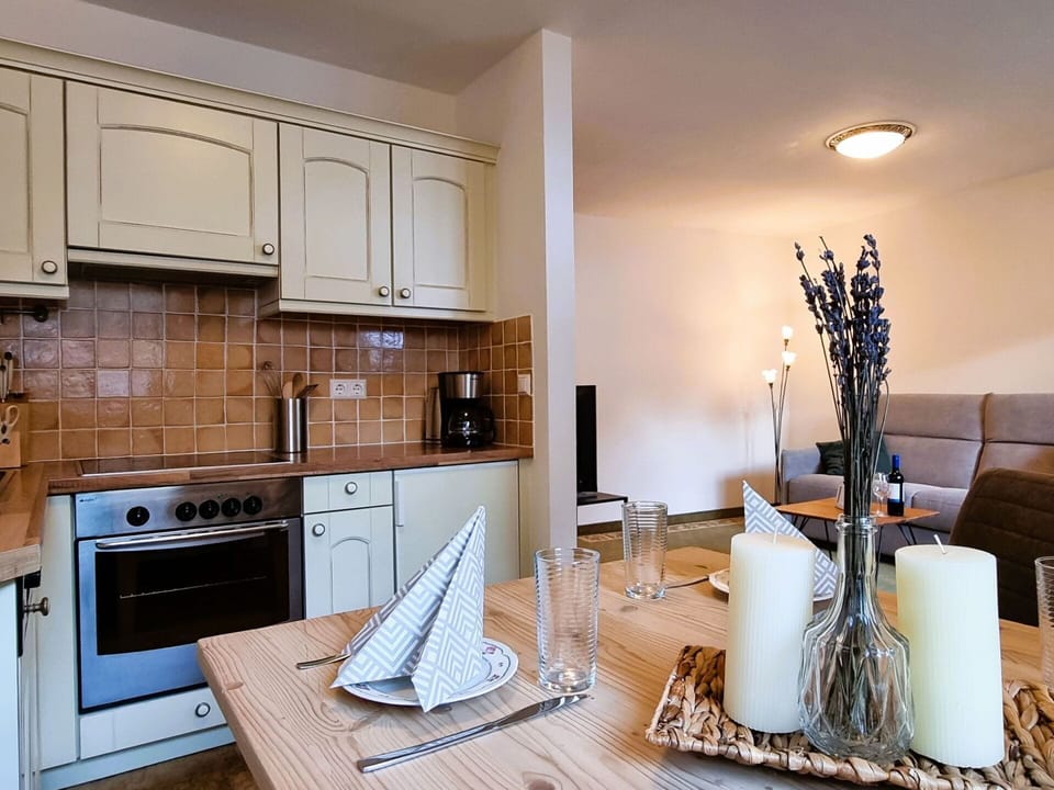 Property, Cabinetry, Countertop, Wood, Building, Lighting, Kitchen Appliance, Kitchen Stove, Interior Design, Flooring