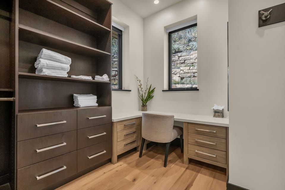 Work Area with Shelfs, Drawers, and a Desk and Chair