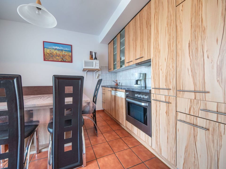 Cabinetry, Property, Countertop, Kitchen Stove, Lighting, Interior Design, Wood, Kitchen Appliance, Home Appliance, Building