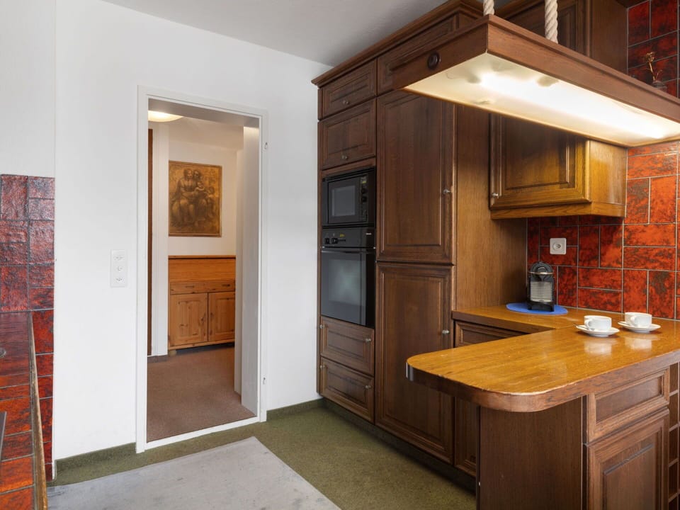 Cabinetry, Interior Design, Furniture, Flooring, Countertop, Wood, Ceiling, Kitchen, Floor, Light Fixture