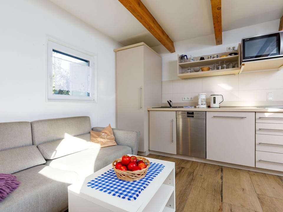 Property, Cabinetry, Countertop, Kitchen Appliance, Couch, Interior Design, Building, Floor, Comfort, Kitchen Stove
