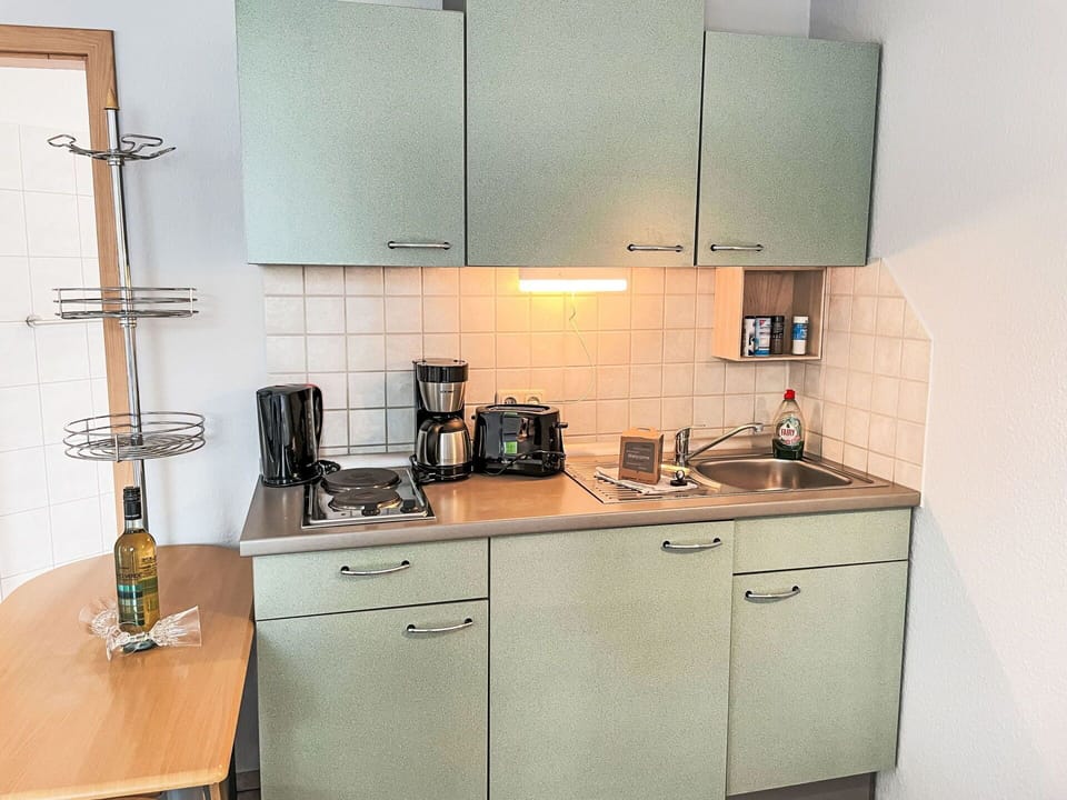 Cabinetry, Property, Building, Furniture, Countertop, Kitchen Appliance, Kitchen Stove, Kitchen, Home Appliance, Wood