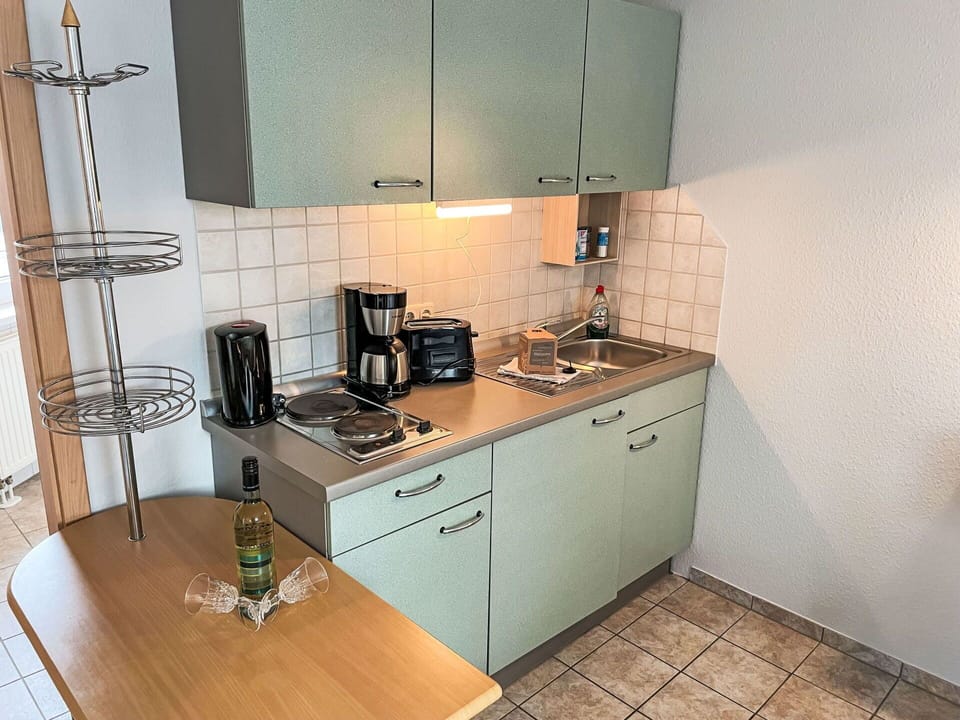 Cabinetry, Building, Countertop, Furniture, Sink, Kitchen Stove, Kitchen Appliance, Tap, Kitchen, Chair