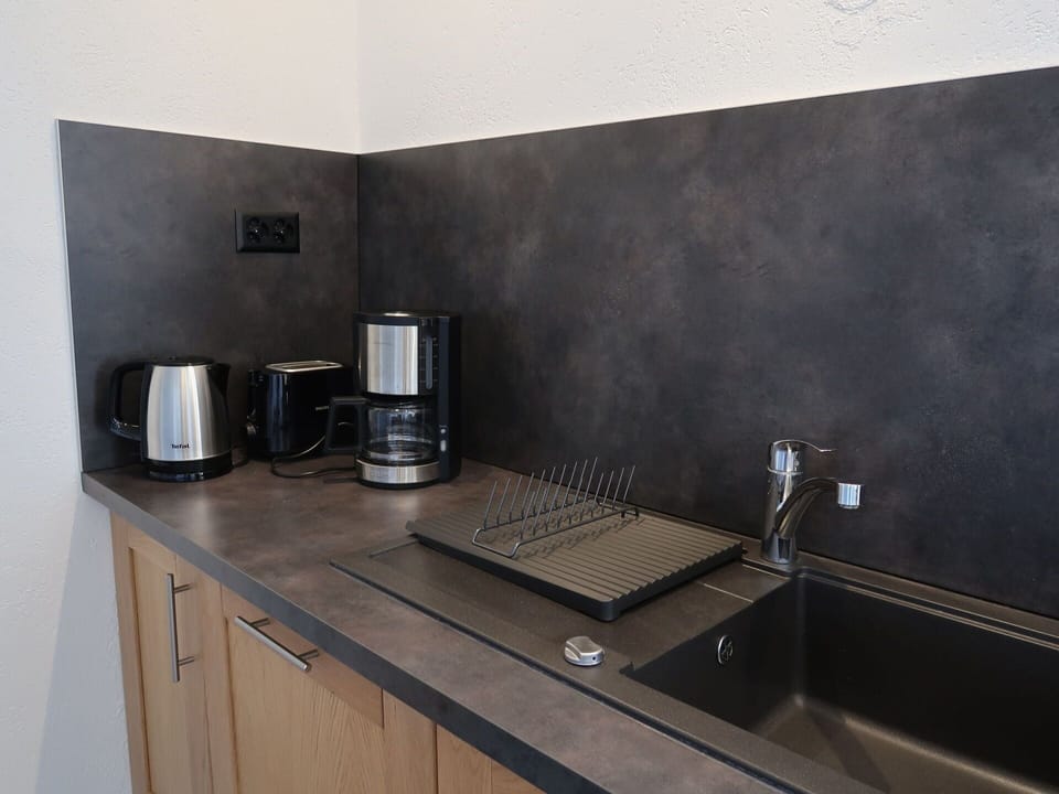 Cabinetry, Countertop, Kitchen Appliance, Kitchen, Home Appliance, Kitchen Stove, Wall, Flooring, Stove, Wood Stain