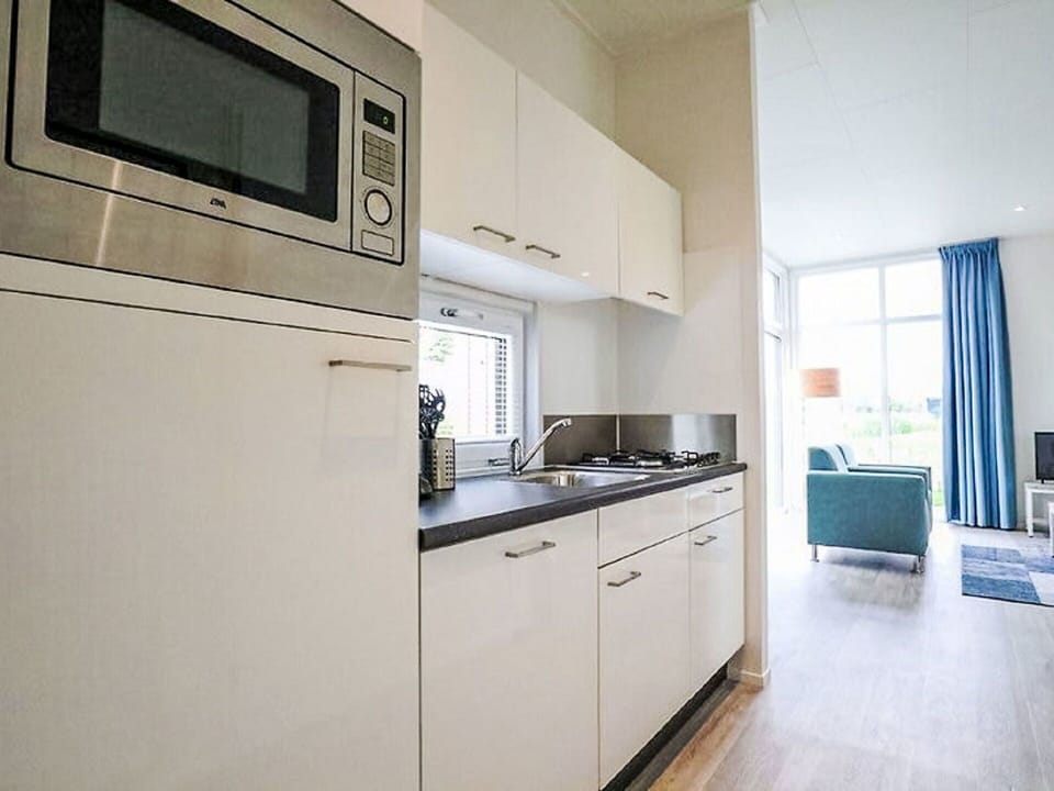 Cabinetry, Tap, Countertop, Sink, Kitchen Sink, Building, Kitchen Appliance, Kitchen Stove, Window, Wood