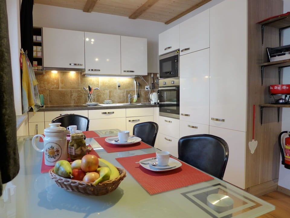 Property, Cabinetry, Food, Countertop, Tableware, Table, Kitchen, Interior Design, Wood, Refrigerator