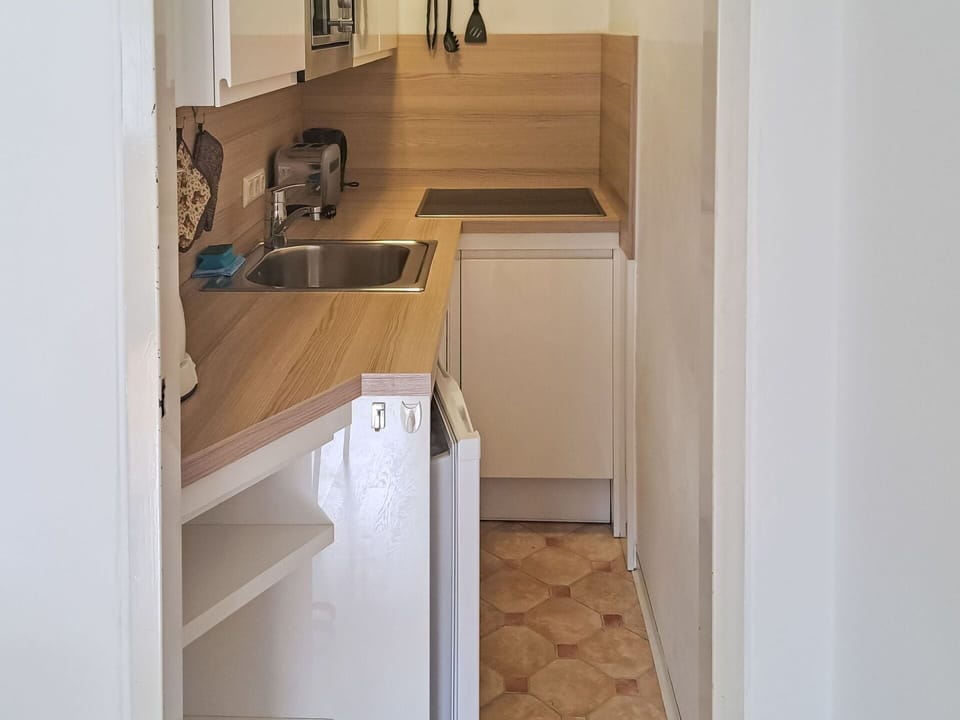 Cabinetry, Countertop, Building, Sink, Wood, Kitchen, Flooring, Floor, Tap