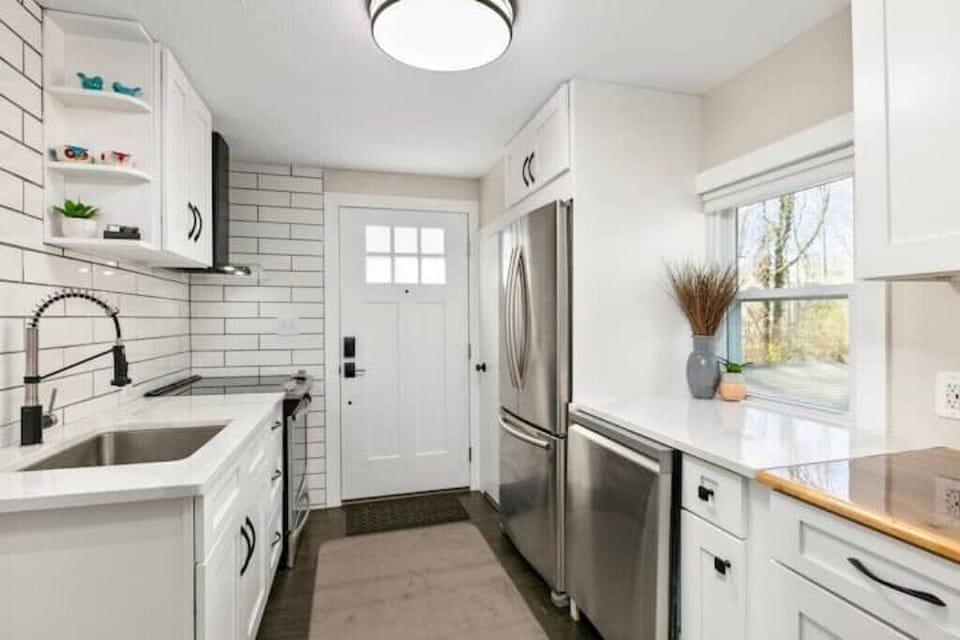 5 burner oven/range, full refrigerator and freezer, dishwasher, small microwave.