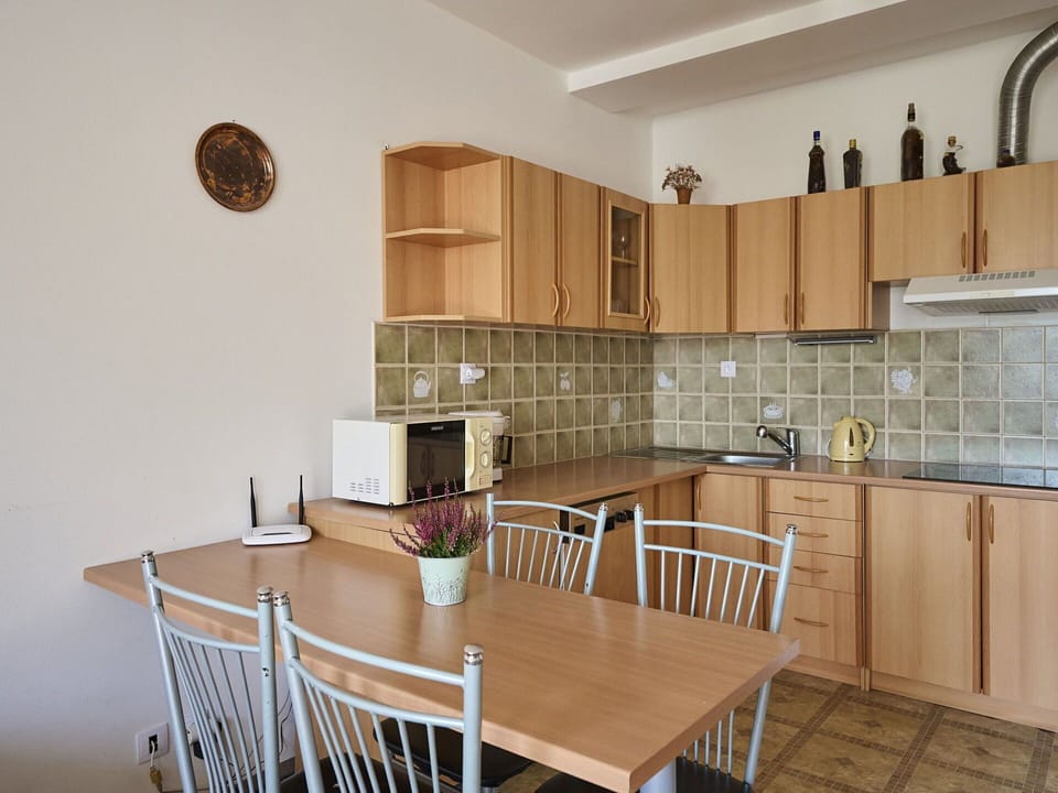 Table, Furniture, Property, Cabinetry, Countertop, Chair, Wood, Interior Design, Lighting, Wood Stain