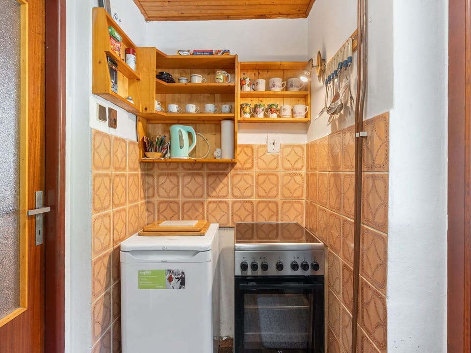 Flooring, Major Appliance, Wood, Floor, Kitchen, Interior Design, Yellow, Kitchen Appliance, Room, Cabinetry